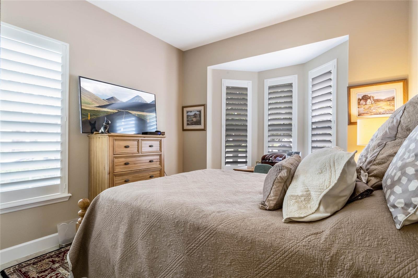 11' x 11' Bedroom #2 w/ ceramic tile floor & Plantation style shutters