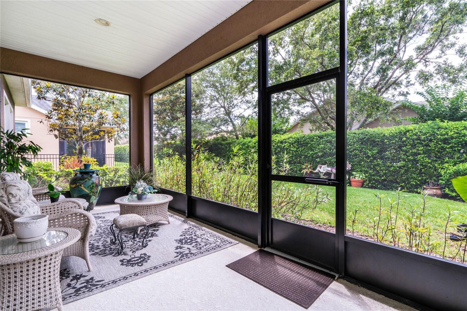 22' x 9' Screen enclosed covered patio & fenced backyard