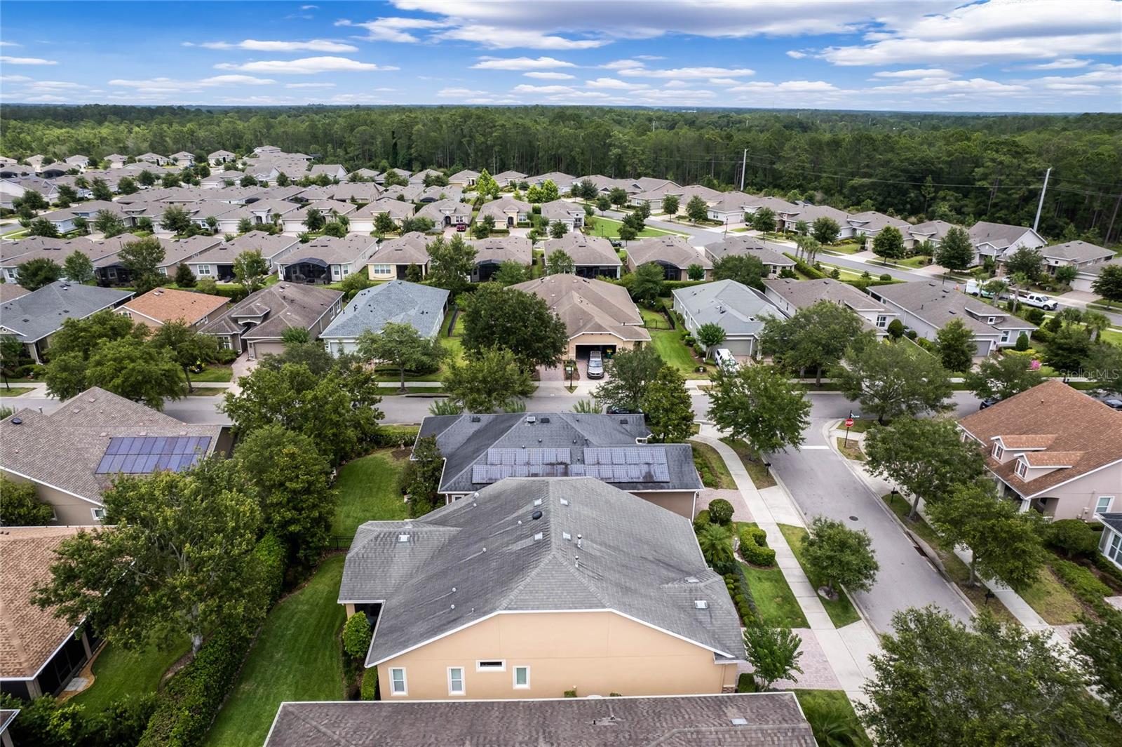 Aerial view from left side of home showing the solar panels on the roof