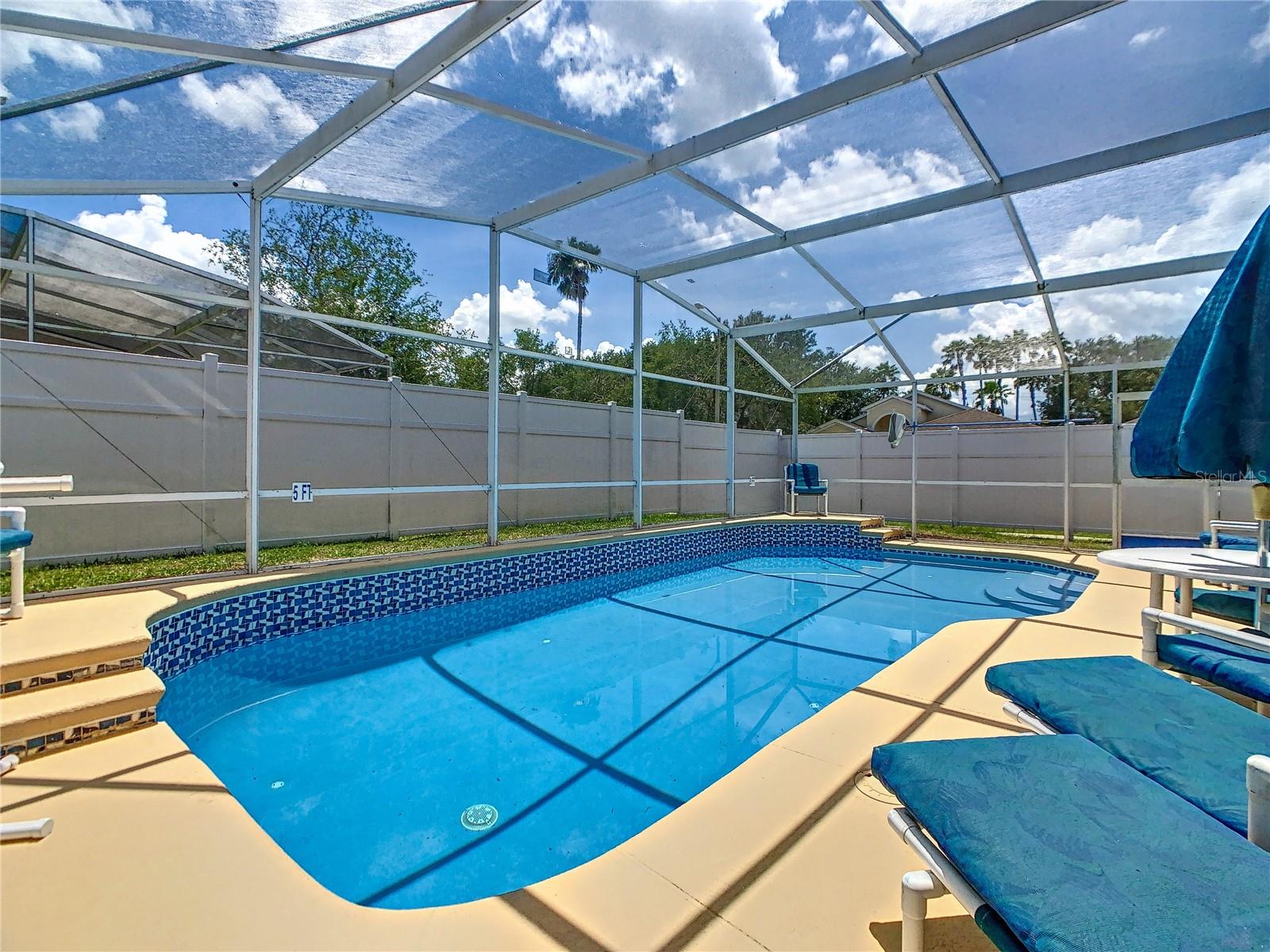 Private south-facing pool with vinyl fencing for added private