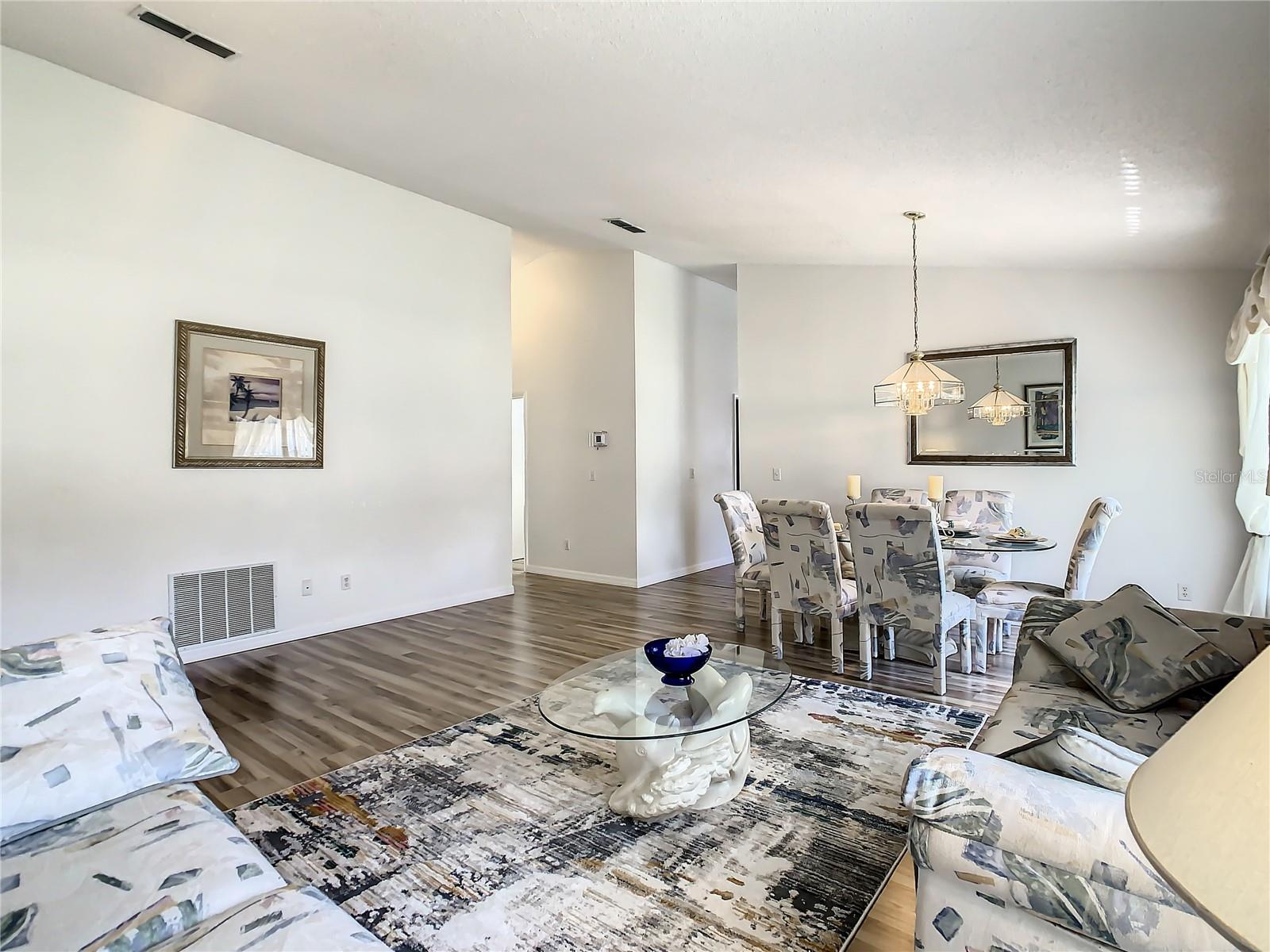 Great room consisting of formal living and dining areas