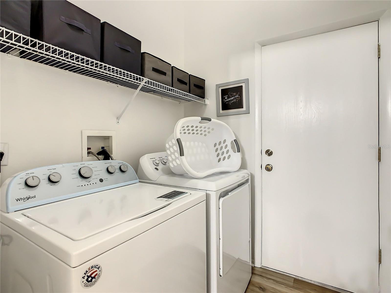 Laundry room with access into garage
