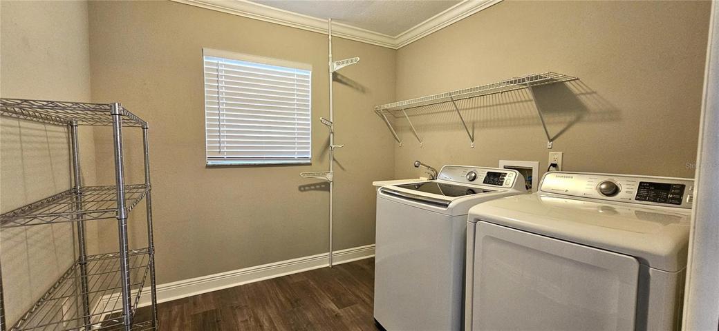Inside laundry room and pantry storage