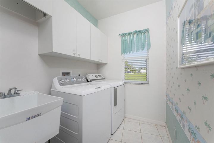 laundry room with sink and closets