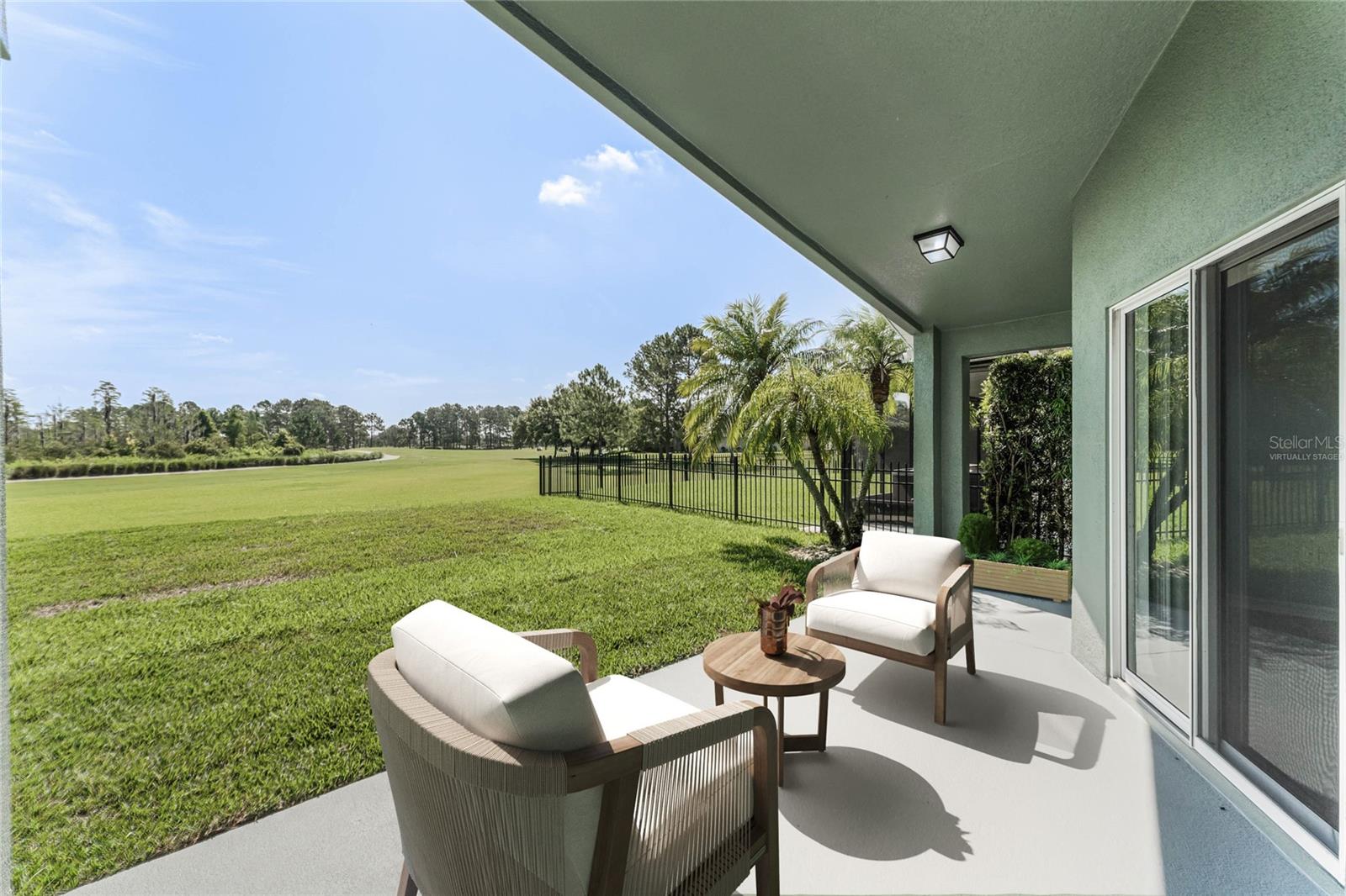 The COVERED LANAI provides a serene retreat where you can relax and soak in the picturesque views! Virtually Staged.