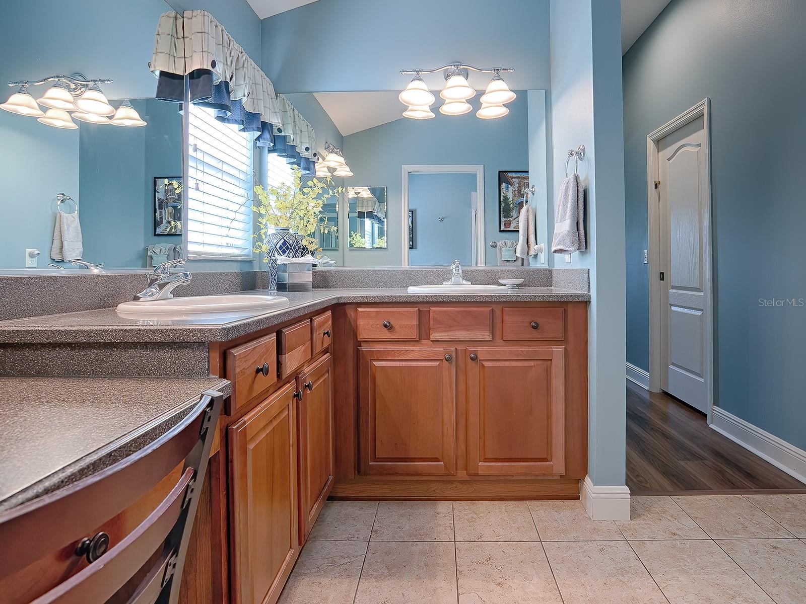 DUAL SINKS, VANITY, LARGE DOUBLE DOOR LINEN CLOSET AND SEPARATE TOILET / SHOWER ROOM.