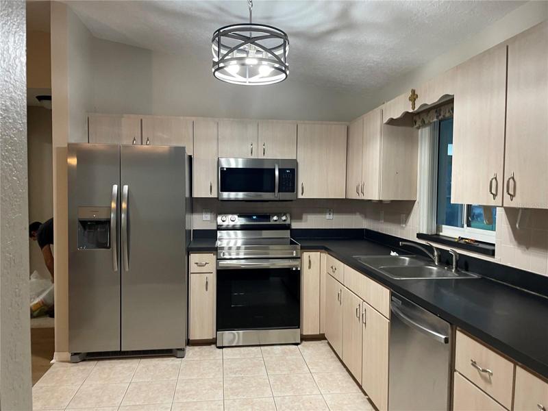 Kitchen with new appliances, lights