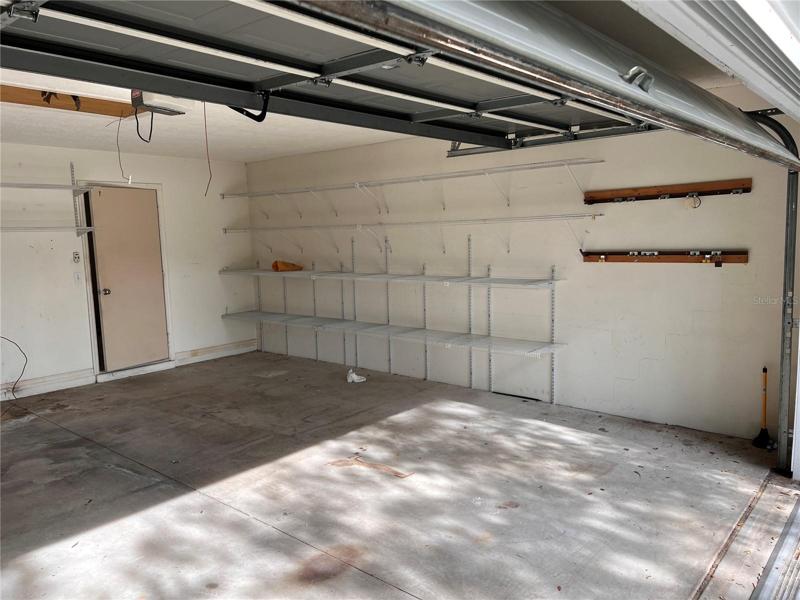 garage with tracks for screens