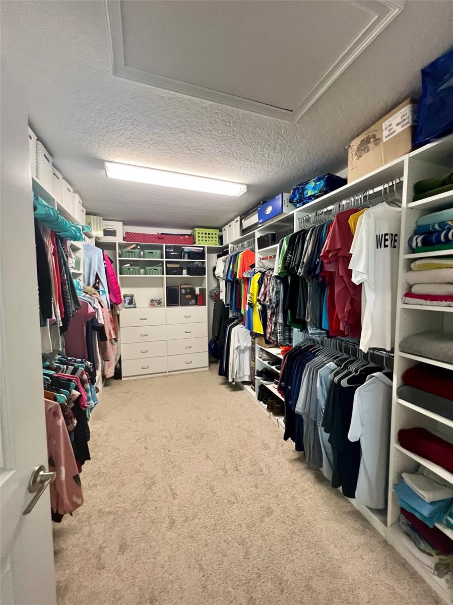 Owners' closet with custom shelving