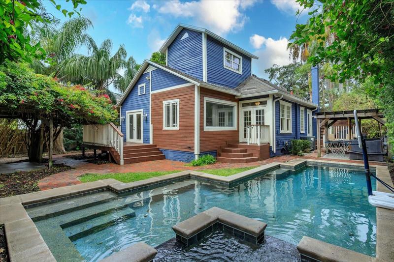 rear view of pool and house