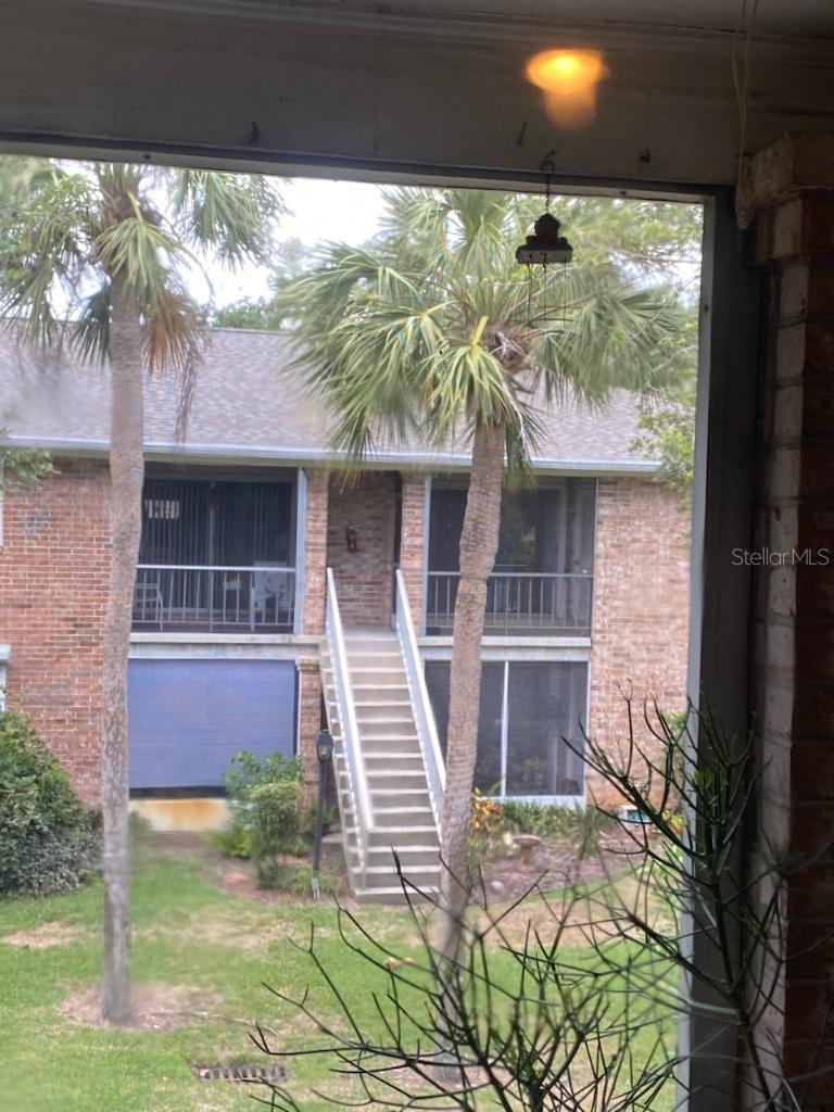 OUTSIDE STEPS LEAD TO BACK AREA OF CONDO.