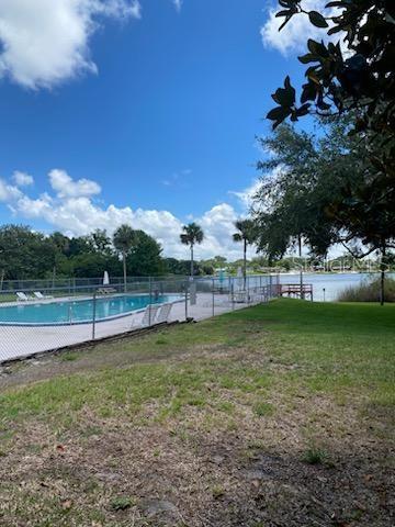 COMMUNITY POOL IN BACK OF LARGE CLUBHOUSE