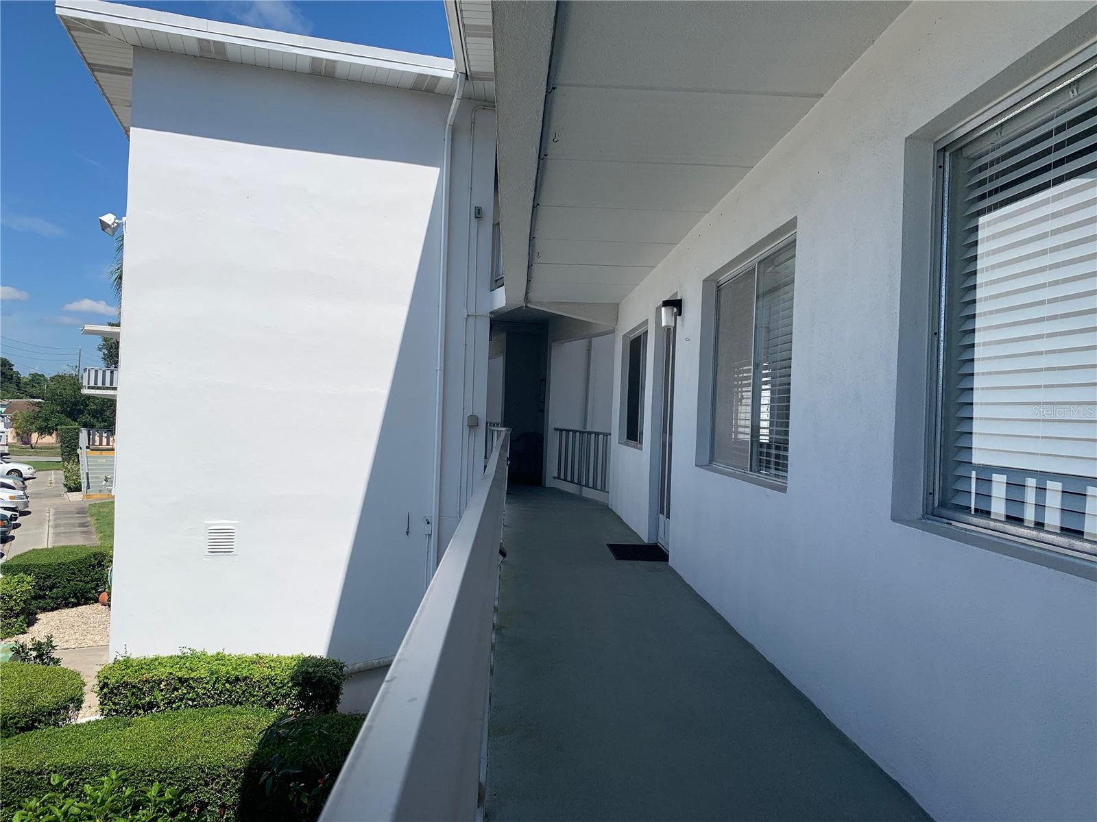 front door of Unit 206, elevator is in the background to the left