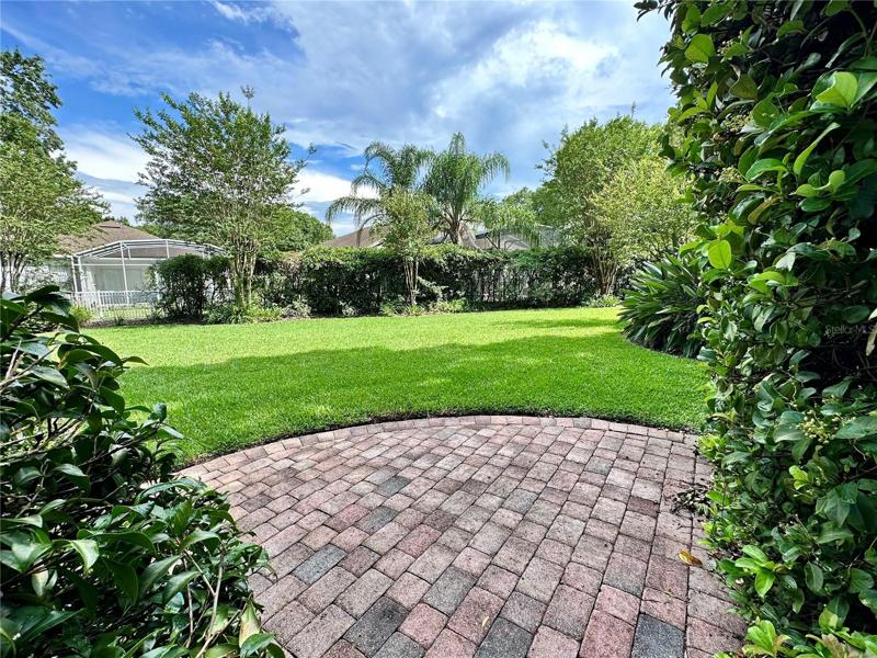 Patio area leading into backyard
