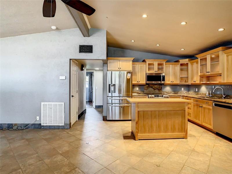kitchen with rolling island  that matches cabinets