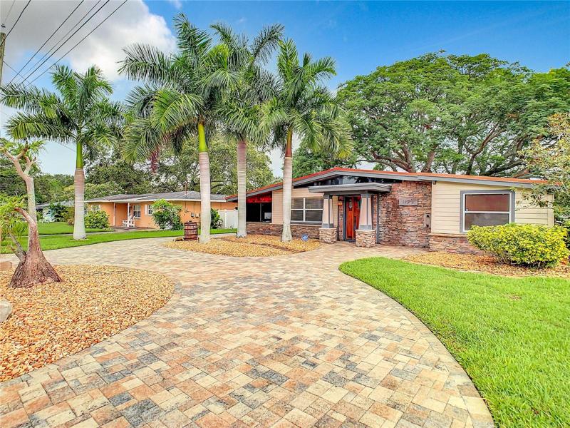 Front of house with beautiful paver driveway