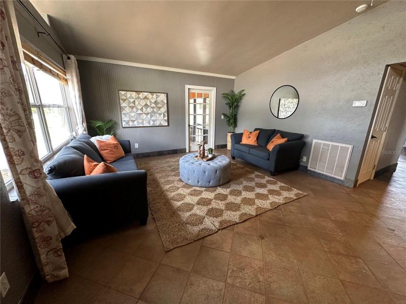 Cozy living room off of kitchen and dining area