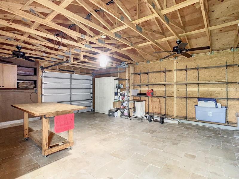 One car garage complete with a workshop on the other side