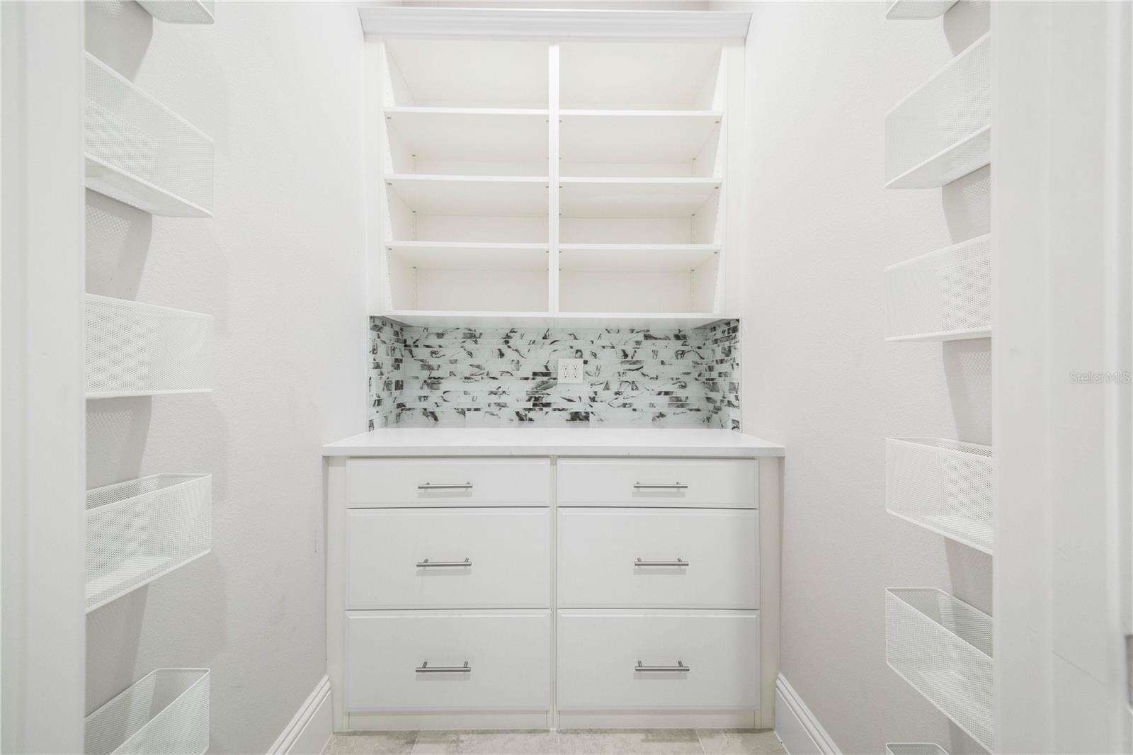 Downstairs Hall Closet Storage is Light and Bright and Organized