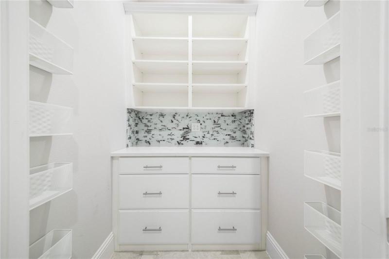 Downstairs Hall Closet Storage is Light and Bright and Organized