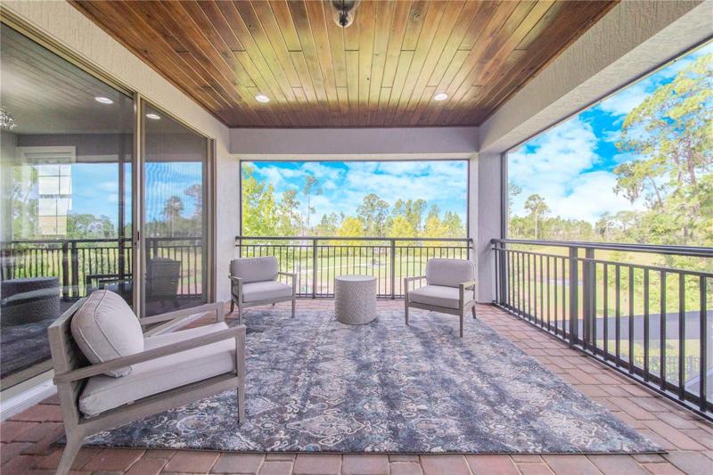 Upstairs Screened Balcony has Park views on one end
