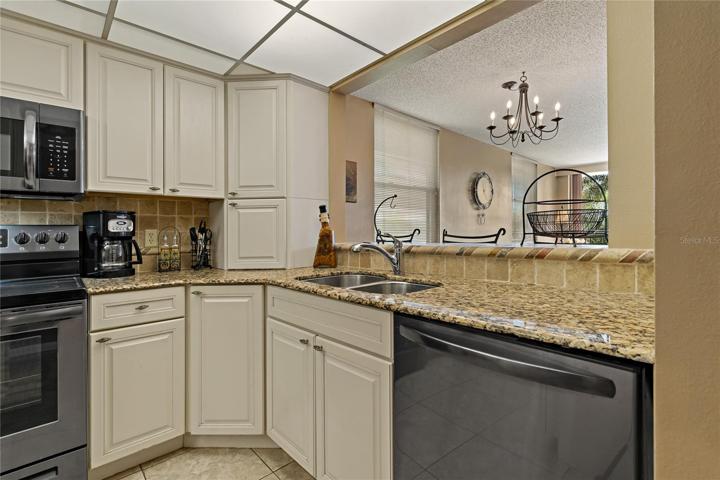 Enjoy nature’s breeze and natural light. Open floor plan. 9x16 renovated kitchen w breakfast bar & dining area.