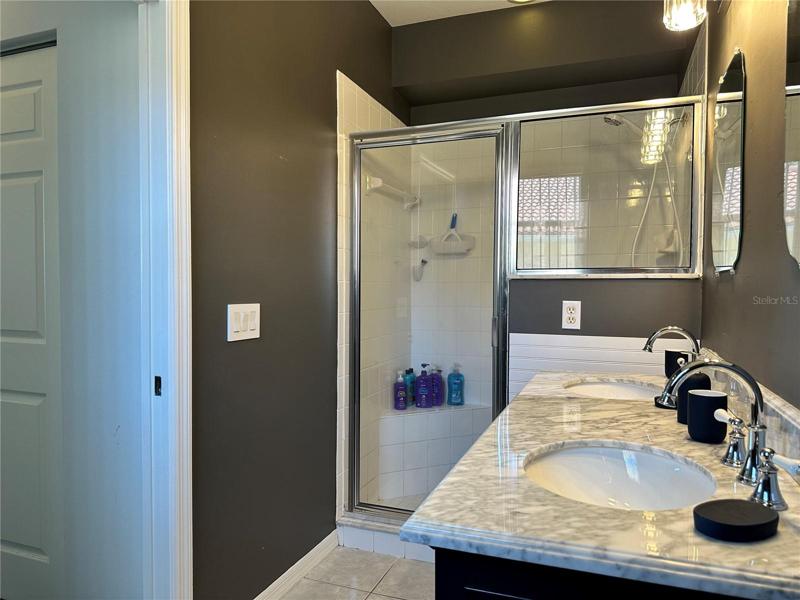 Master Bathroom with tiled shower & glass door