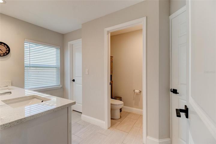 Private water closet (toilet), walk in closet & walk in shower.
