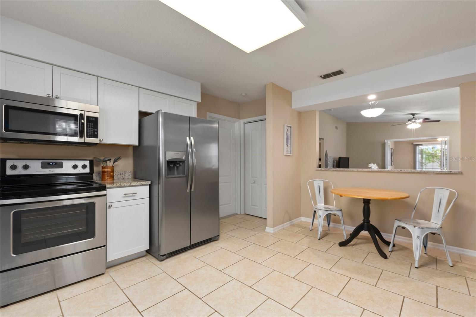 Kitchen with eat in space and passthrough