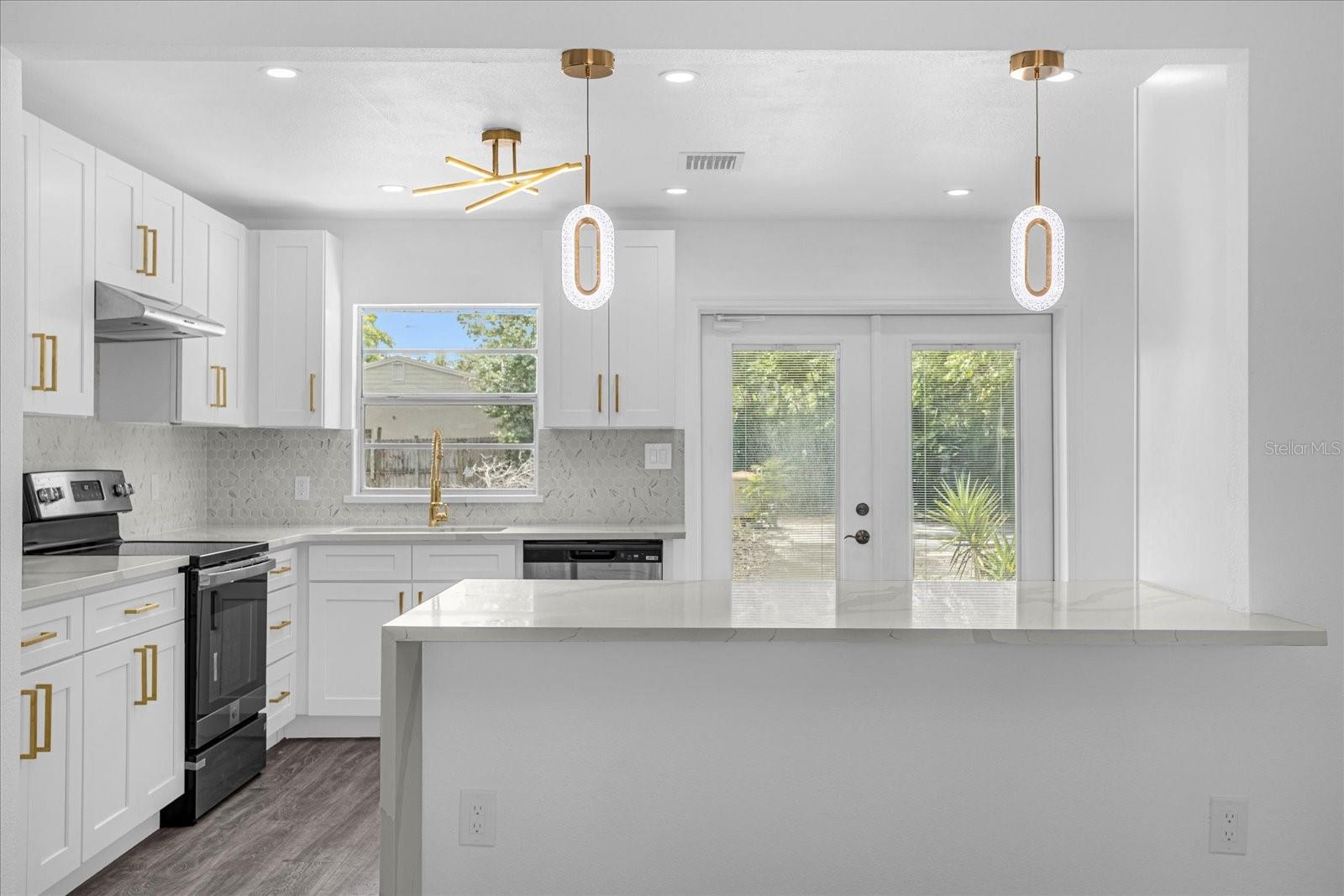 Patio doors to back yard, Breakfast bar, all new SS appliances