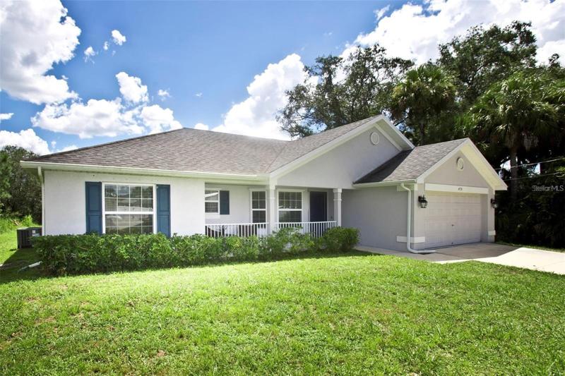 Welcome home to Lorri Circle! Split floor plan 3 bedroom, 2 bathroom home with cathedral ceilings, LED lights, stone counters. New Tangelo tree! WOW!