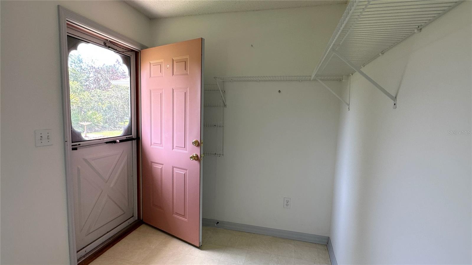 The door from the laundry room to the backyard enhances the functionality of the space, allowing for efficient and convenient outdoor tasks. Whether it's hanging clothes to dry on a sunny day, bringing in outdoor equipment, or simply enjoying a breath of fresh air while attending to laundry, this direct access door makes it effortless.