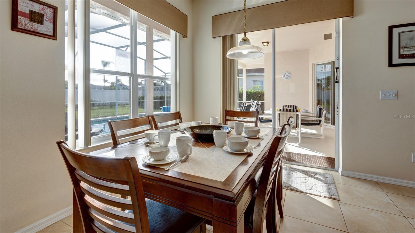Breakfast nook providing access to the covered lanai and pool area.