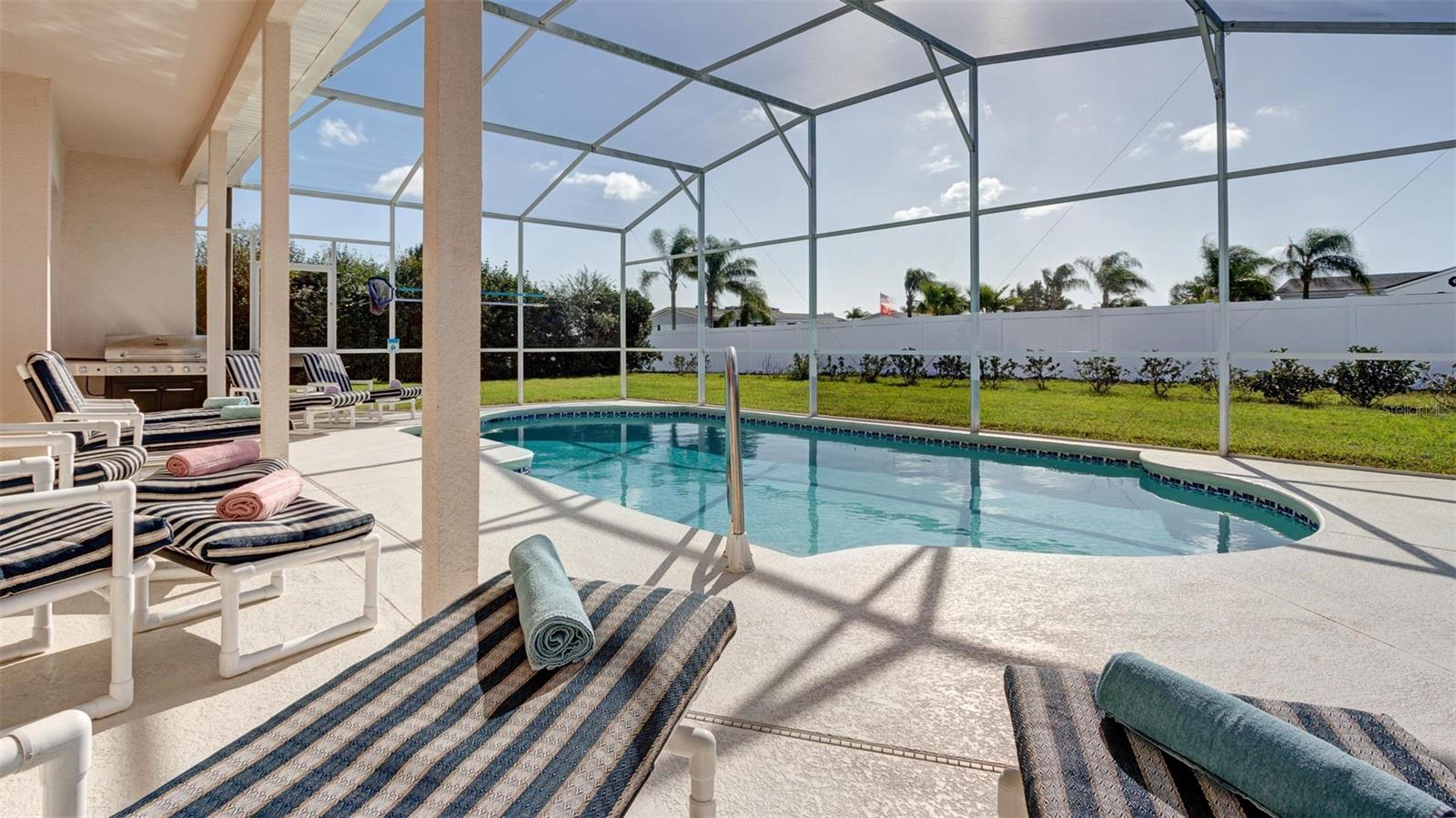 Generous sized patio covered lanai area provide welcome shade from the hear and summer storms.