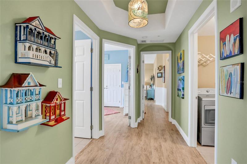 Large hallway with tray ceiling