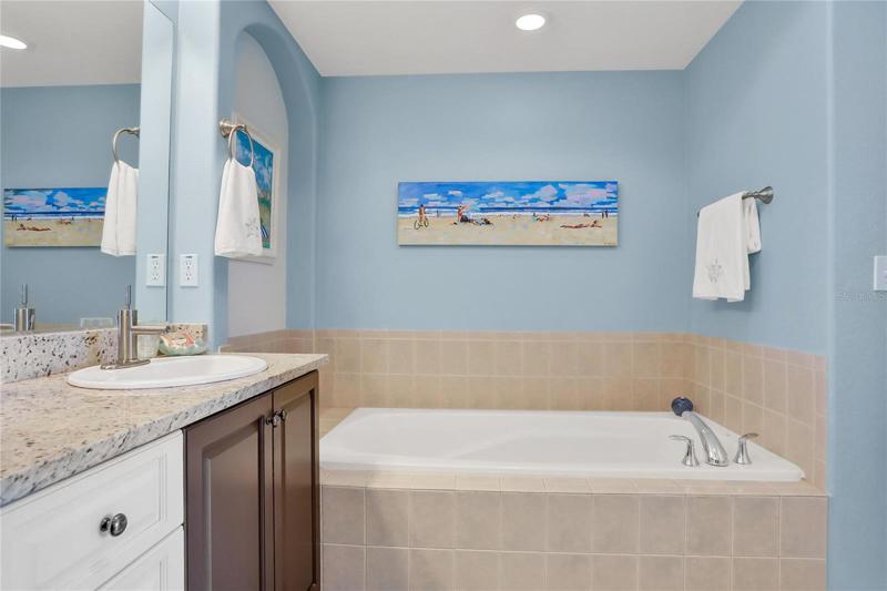 Double sinks, granite counters, spa tub