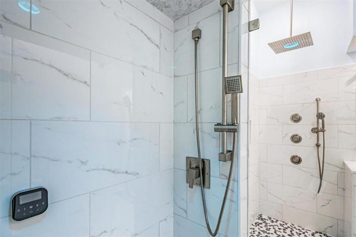 Frameless glass walk in shower with 16