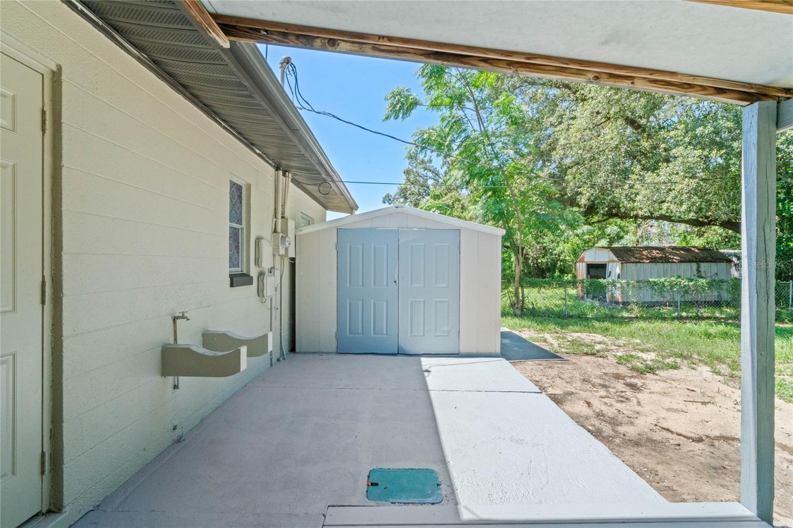 Open patio space &amp; storage shed