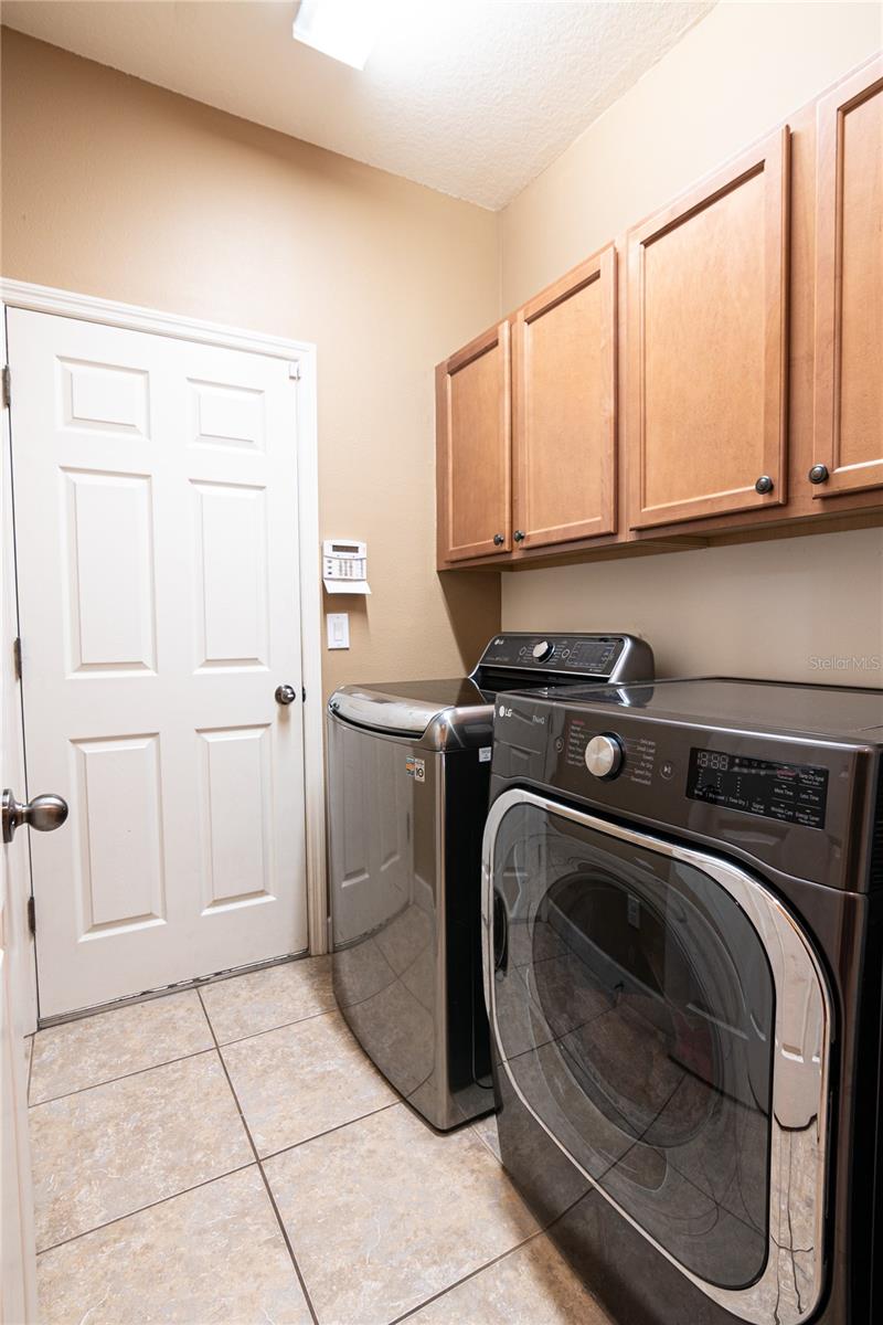 Laundry room with built-in cabinets