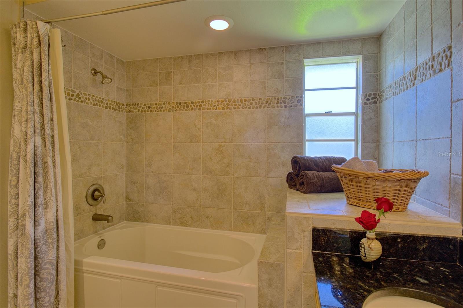Full tub with updated tile.