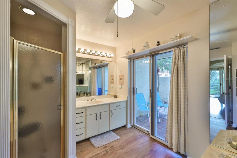 Primary bathroom with shower and courtyard access.