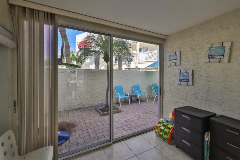 Covered sitting area with access to courtyard.