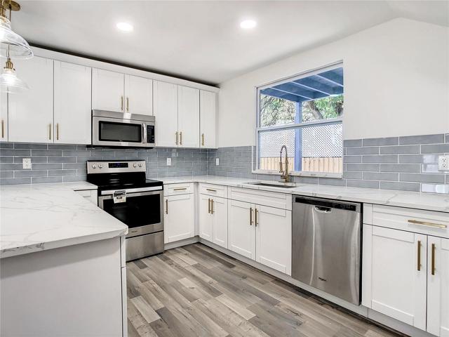 Quartz Countertops and Shaker Cabinets