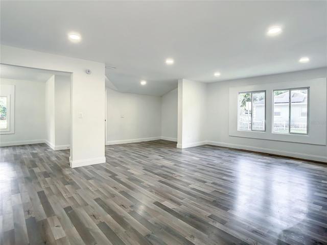 Open Living Room Area to Family Room, Dining Room and Half Bath