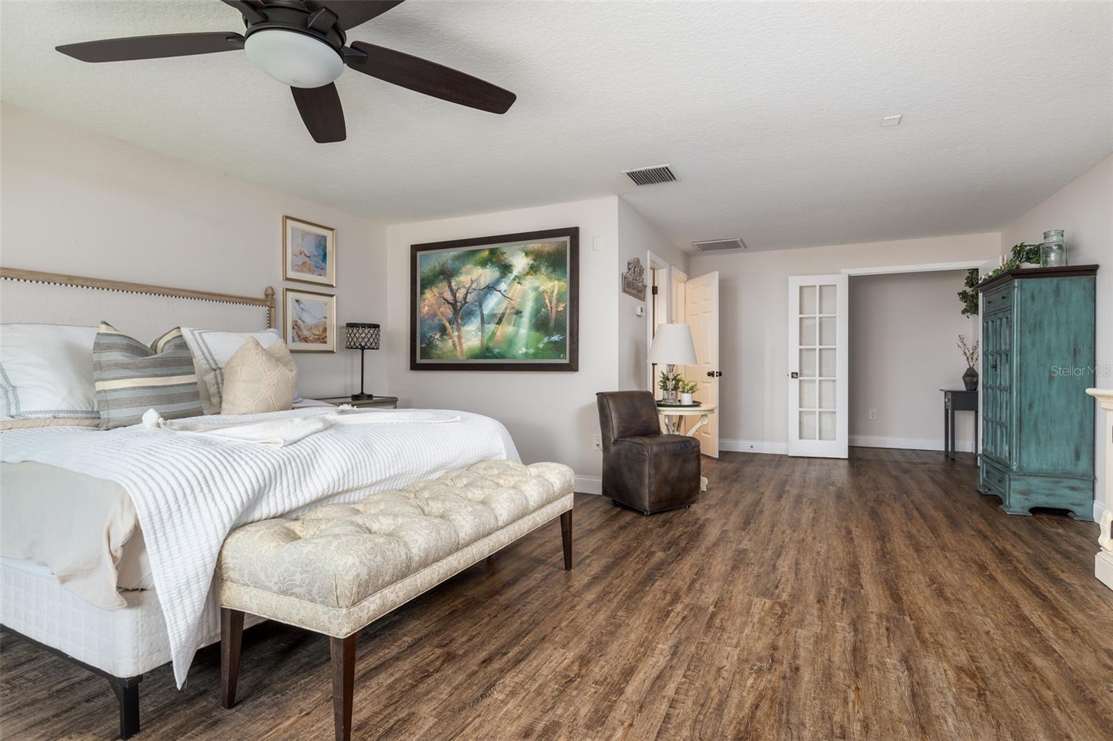 Upstairs loft with a private bathroom being used as a guest bedroom