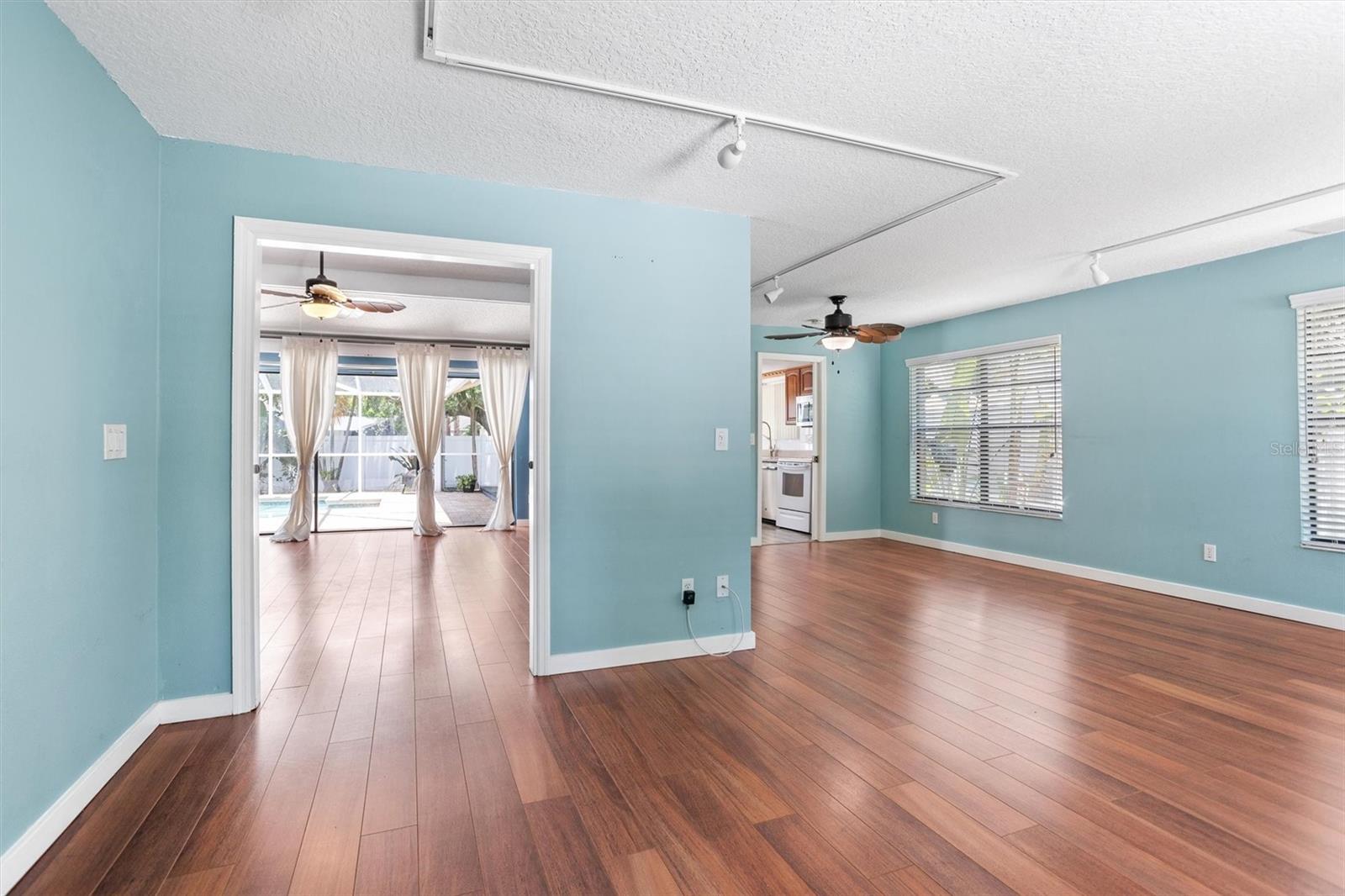 As you enter the home, living room and dining area