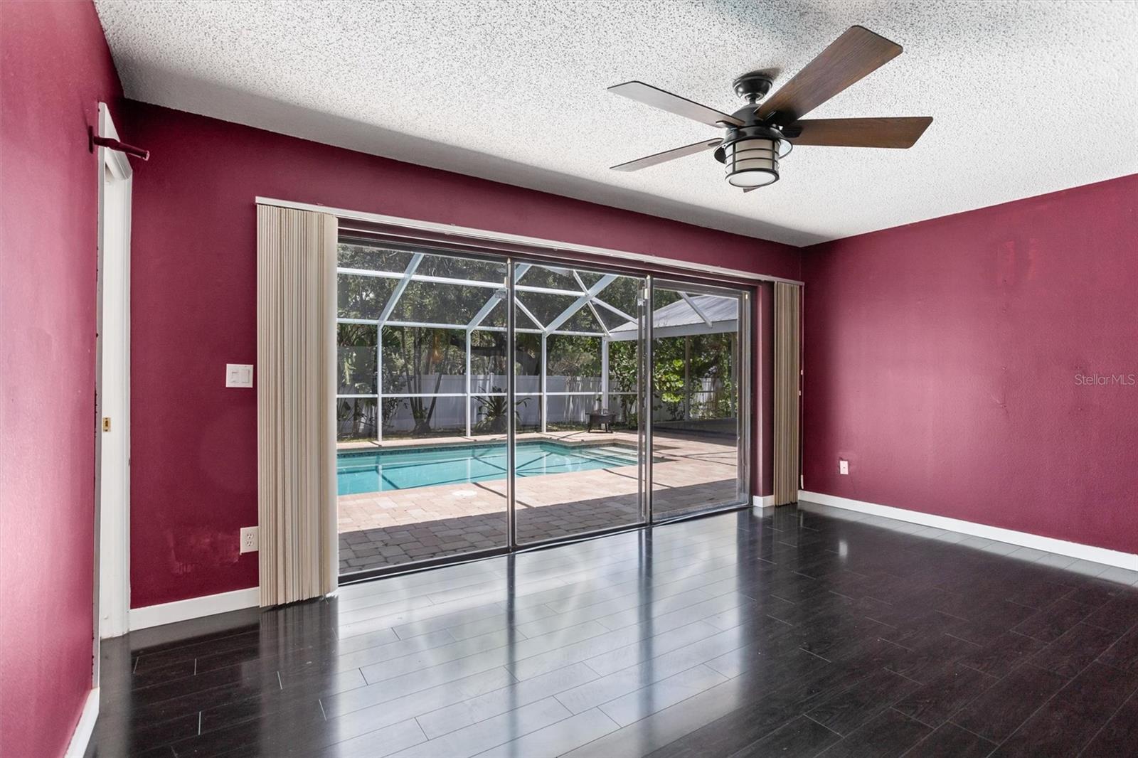 Primary bedroom with sliders to the pool