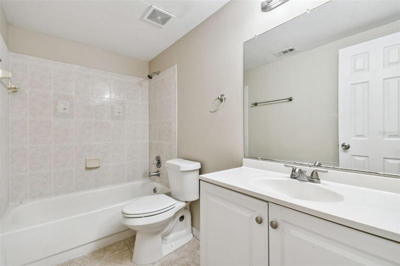 Tub/shower combo in bathroom.