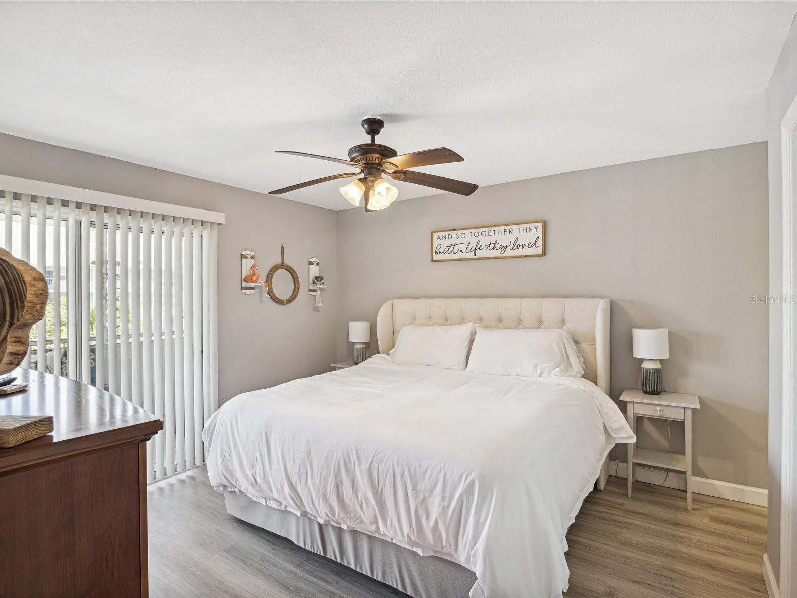 Master bedroom with sliders out to the balcony