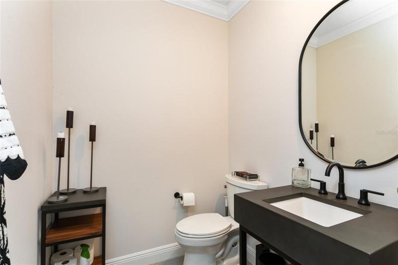 A half bath in the foyer hallway is perfect for guest use.